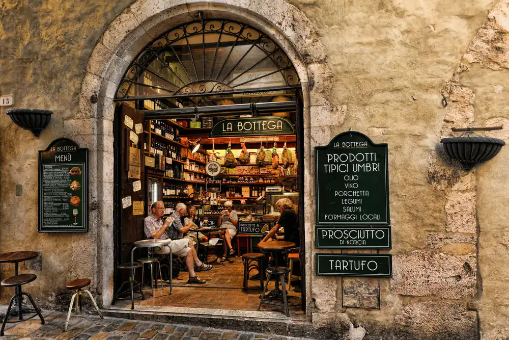 Outside our cheese and deli shop with rustic signage